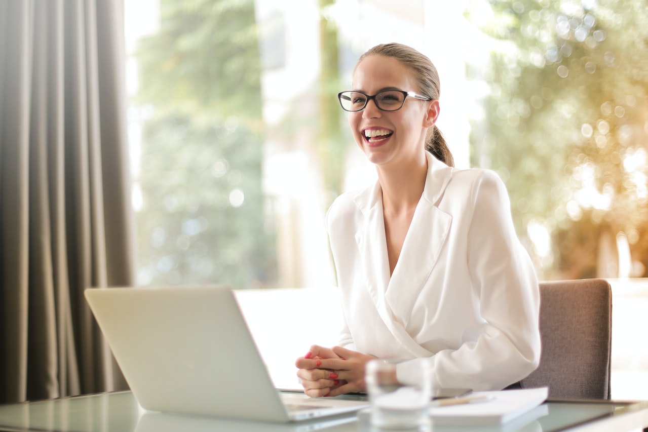 women smiling an desk nwls careers 