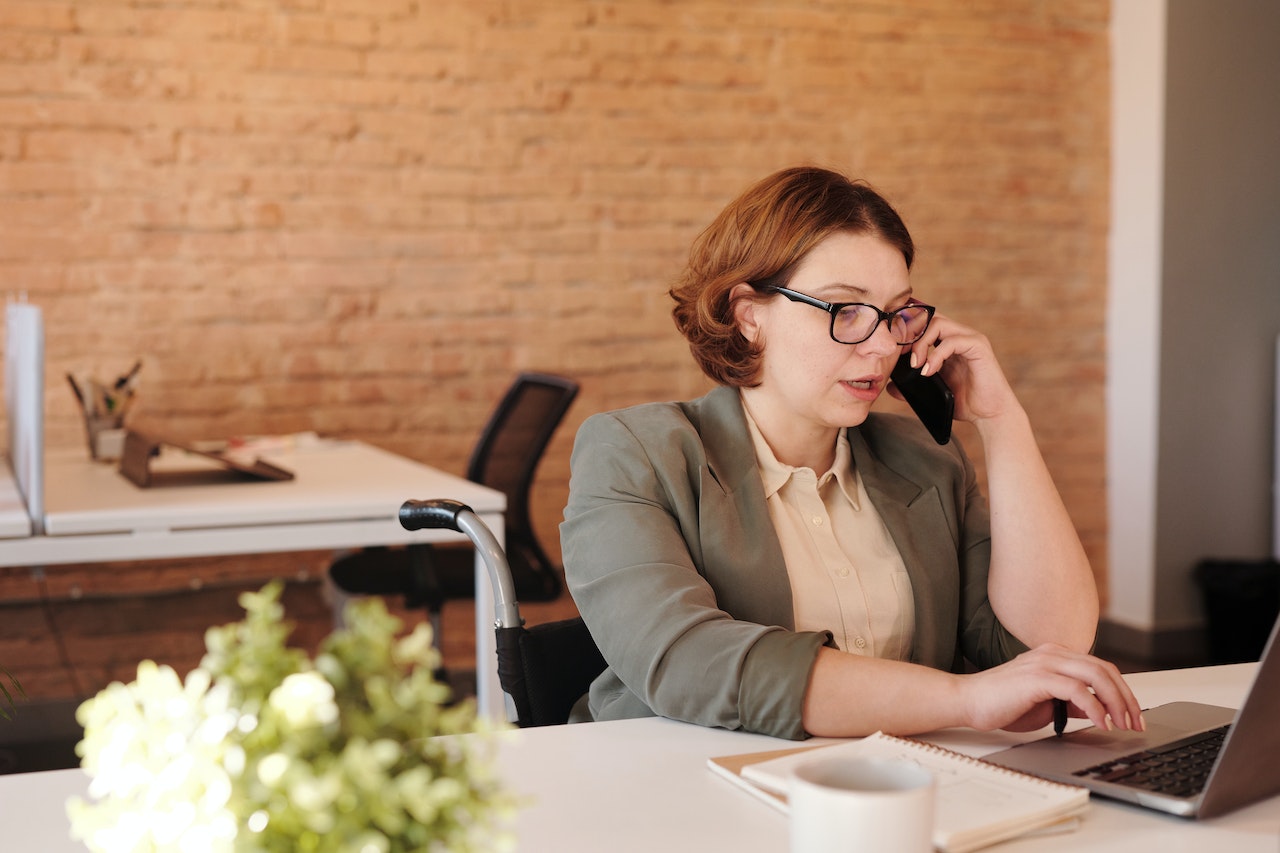 nwls phone advice lawyer speaking on phone in office 