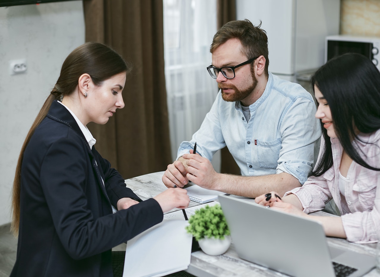 nwls types of cases lawyer with clients at desk 